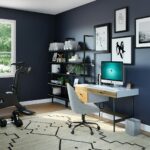 black flat screen computer monitor on brown wooden desk