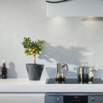 silver pot on top of induction oven, kitchen coutertop decor ideas