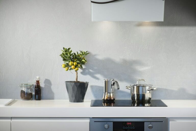 silver pot on top of induction oven, kitchen coutertop decor ideas