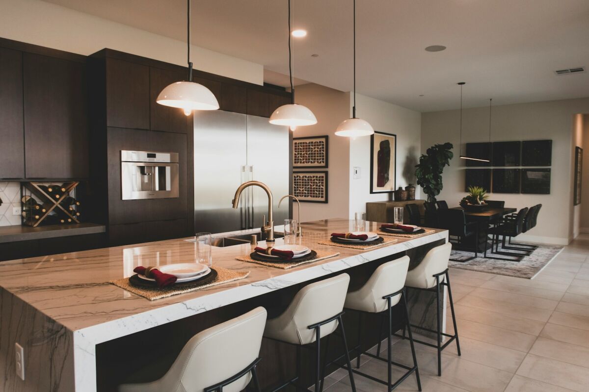 a kitchen with a marble counter top and a center island, Kitchen Island Ideas