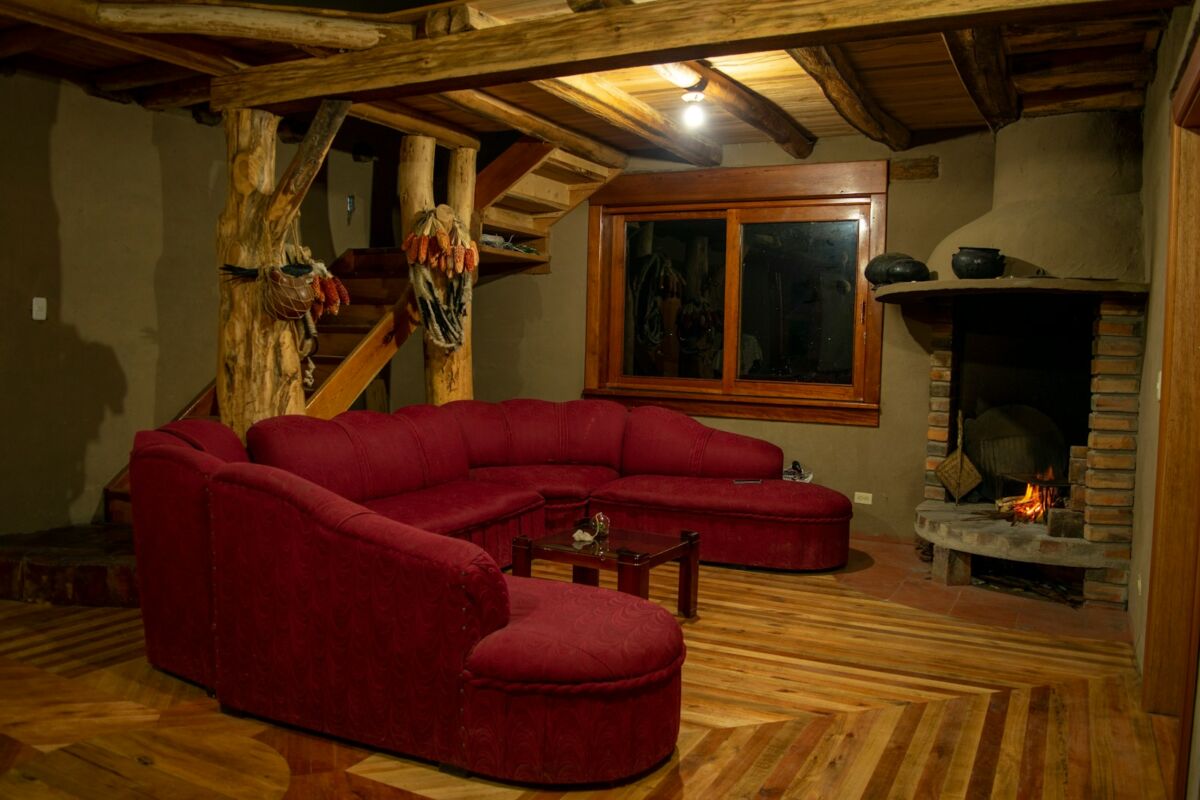 a living room with a red couch, Primitive Decor Ideas
