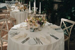 a table set with plates and silverware, Wedding Tablescape Ideas