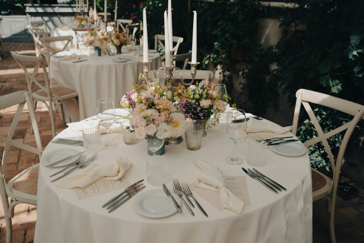 a table set with plates and silverware, Wedding Tablescape Ideas