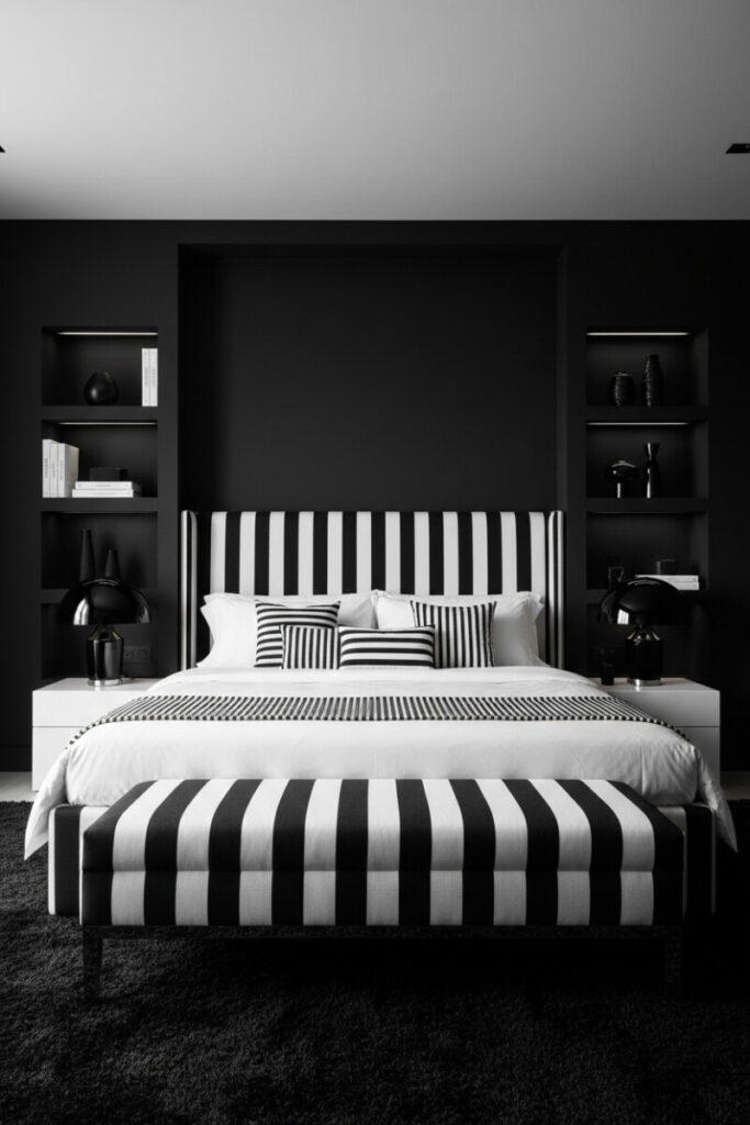Black-and-white striped headboard and duvet, matte black shelves with sculptural ceramics, and glossy dome lamps—graphic Dark Bedroom Designs.