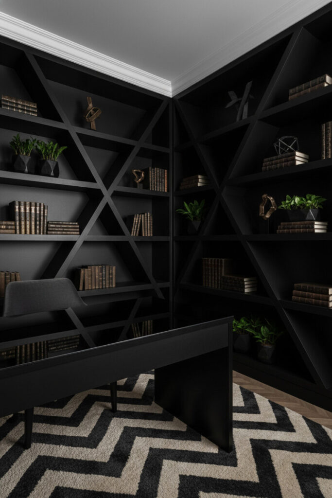 Geometric shelving and black lacquer desk under dramatic chiaroscuro light illustrating modern moody interior design.