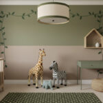 Oversized plush giraffe, zebra, and blue elephant against two-tone olive and taupe wall with vine decals, balancing crib and desk—playful jungle nursery ideas.